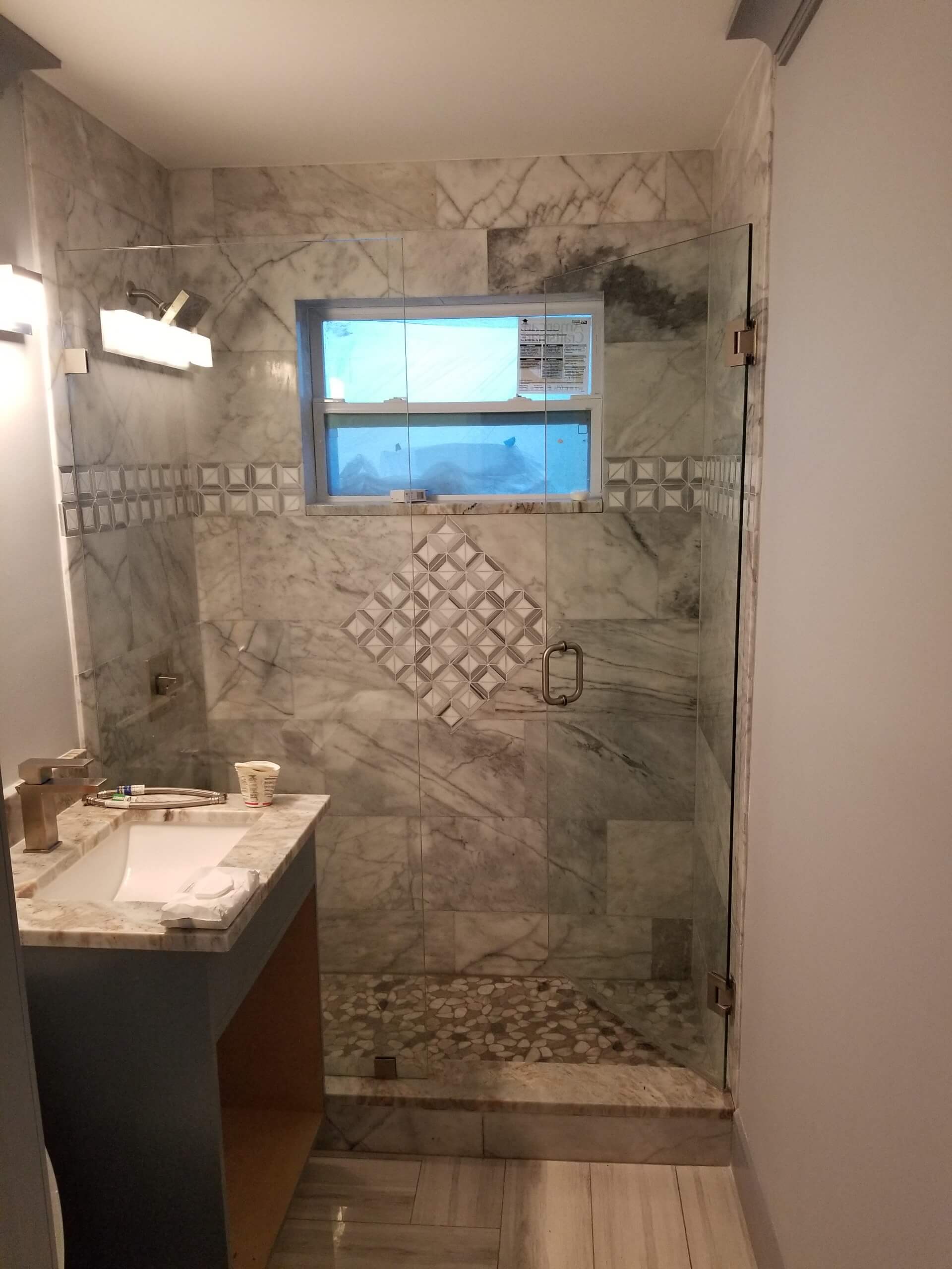 small remodeled shower gray tile
